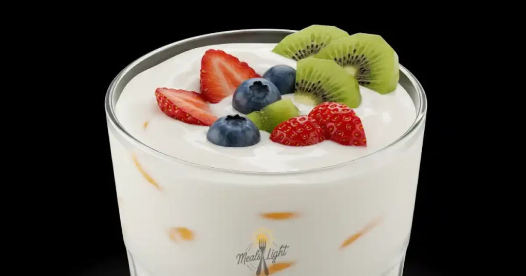 Close-up of a refreshing cold yogurt drink with fruit garnish
